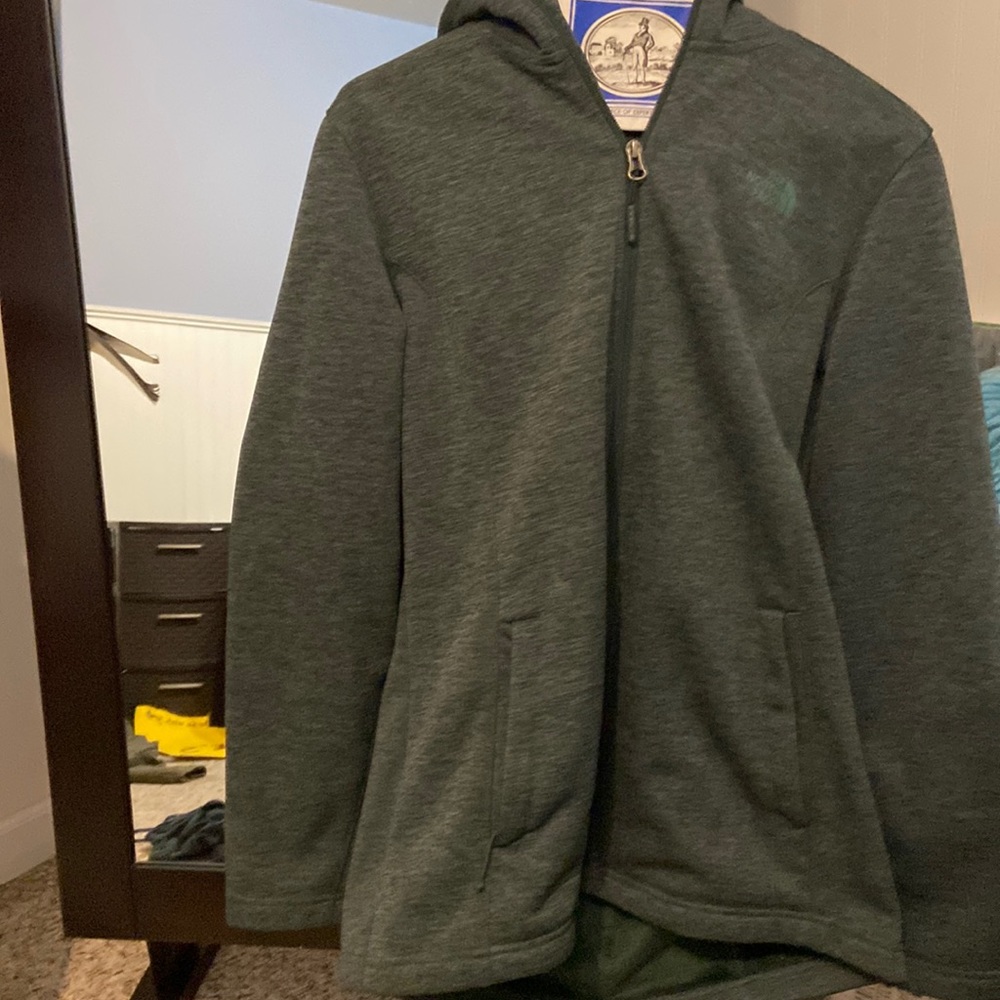 Warn green North Face jacket. Very soft on the inside. Only worn a few times.